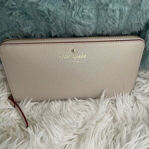Kate Spade Beige Wallet with Red Zipper